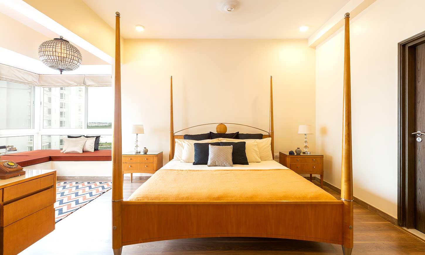 A master bedroom with rustic design for apartment interiors in bangalore