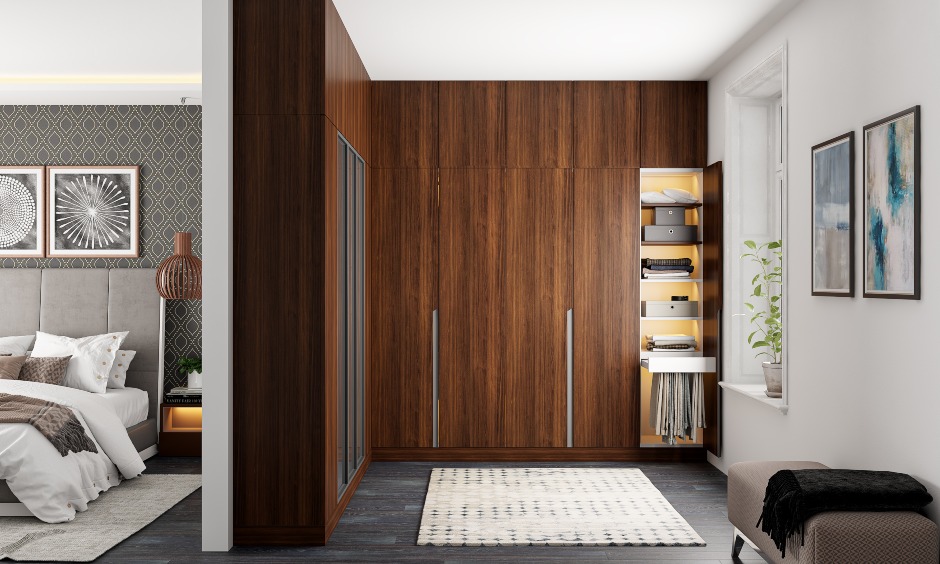 Wooden wardrobe design with space saving solution